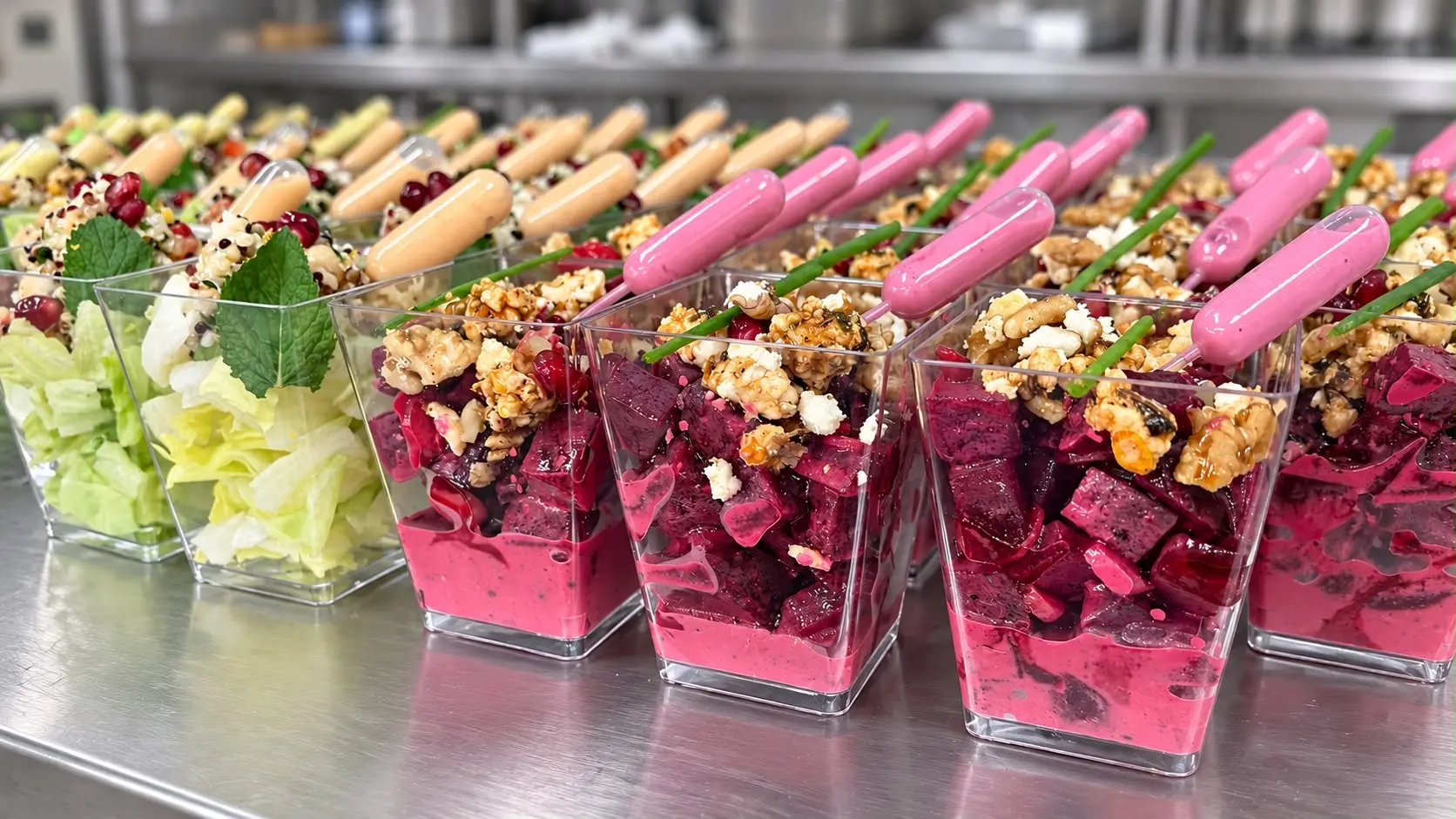 Row of beet and lettuce salad cups