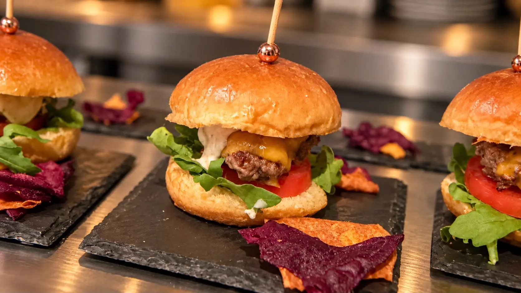 Mini burgers on slate