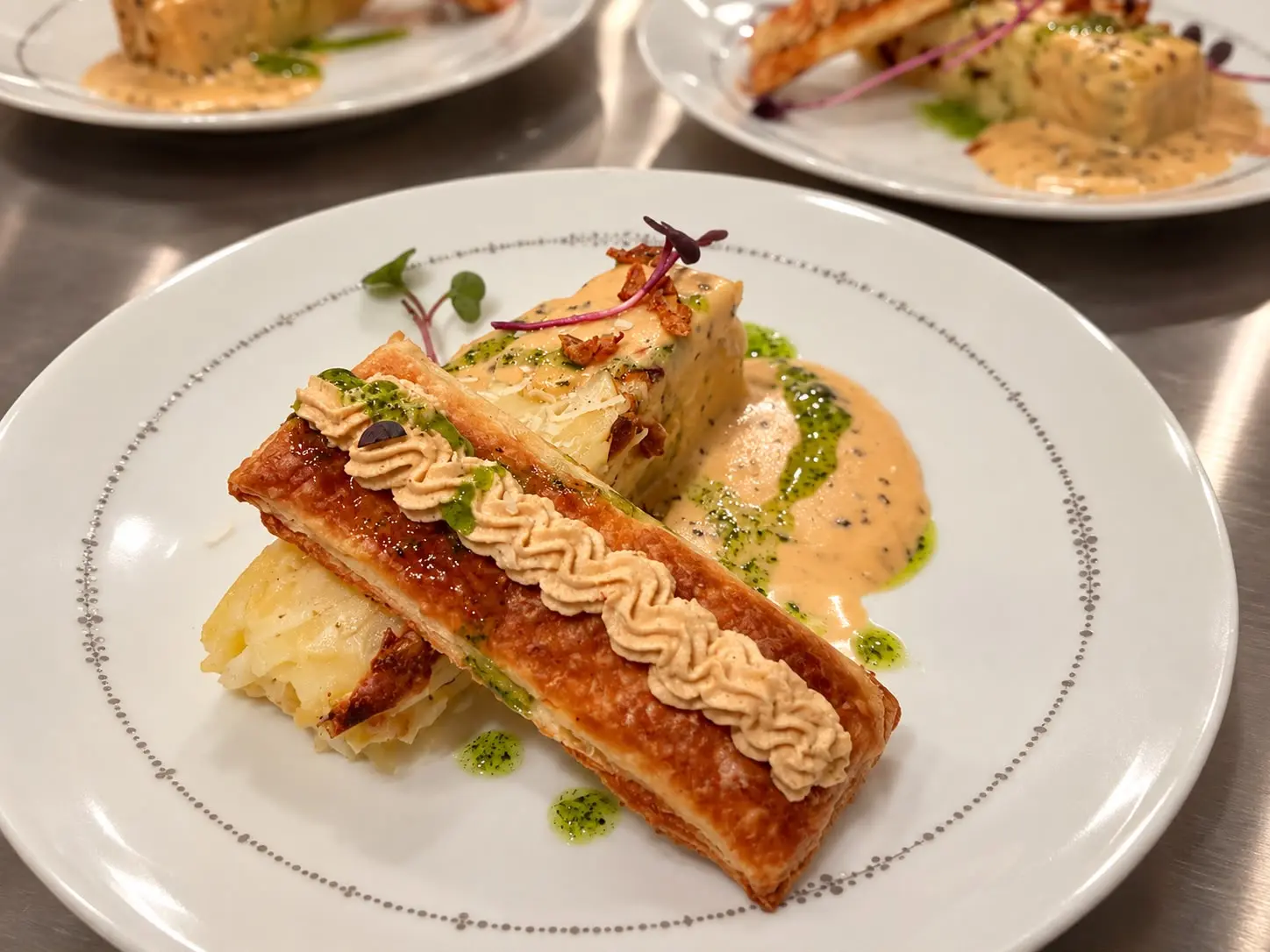 Pastry plated with sauce