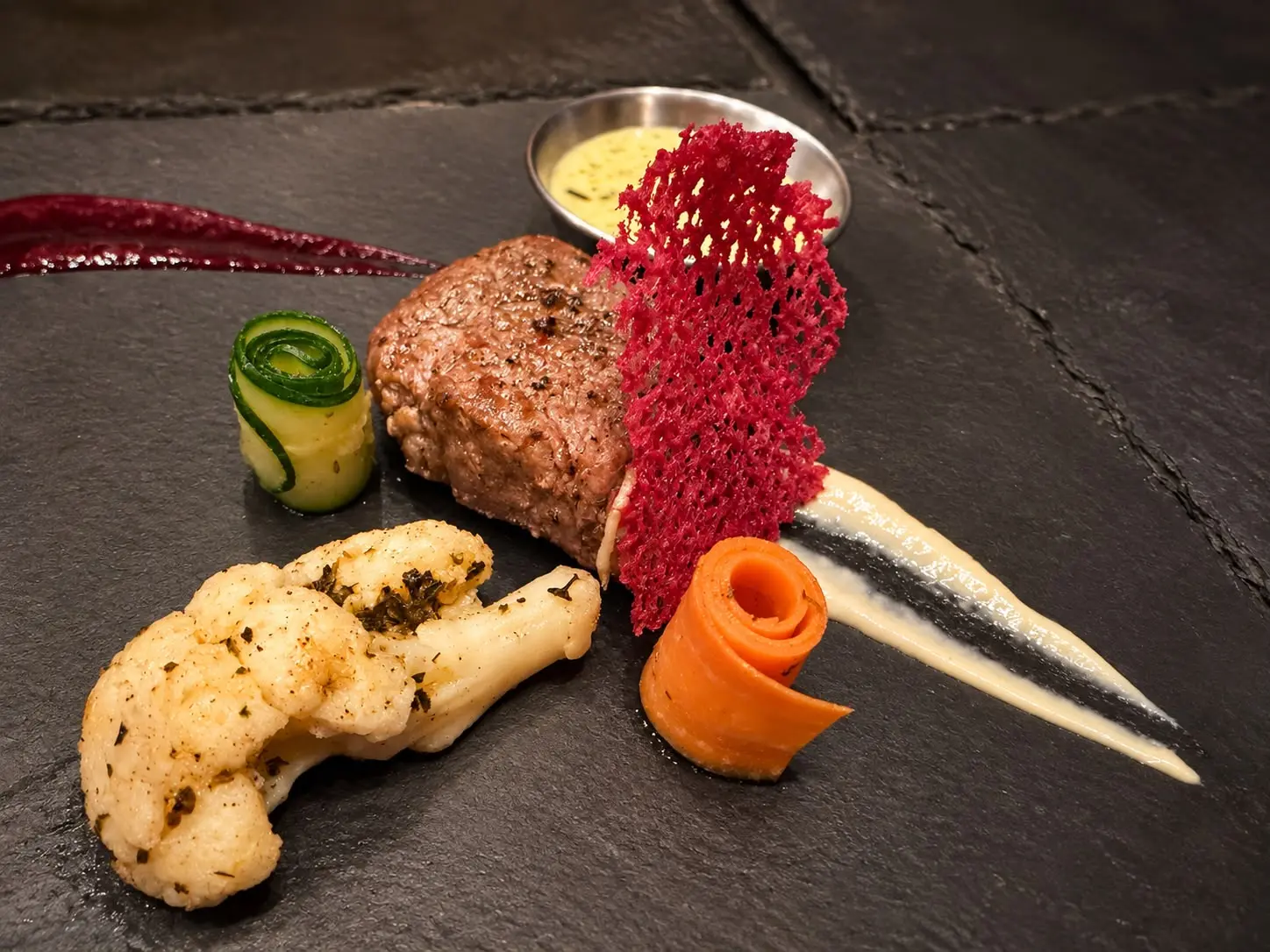 Plated steak with vegetables